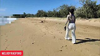 Big-chested beauty walks solo seaside